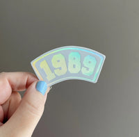 1989 Collegiate white holographic sticker MangoIllustrated