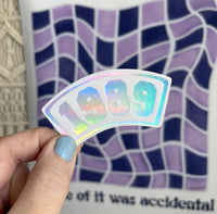 1989 Collegiate white holographic sticker - MangoIllustrated - Sticker