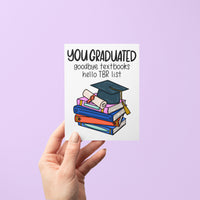 Bookish Graduation Card flat — hand drawn illustrated graduation card for book lovers by MangoIllustrated