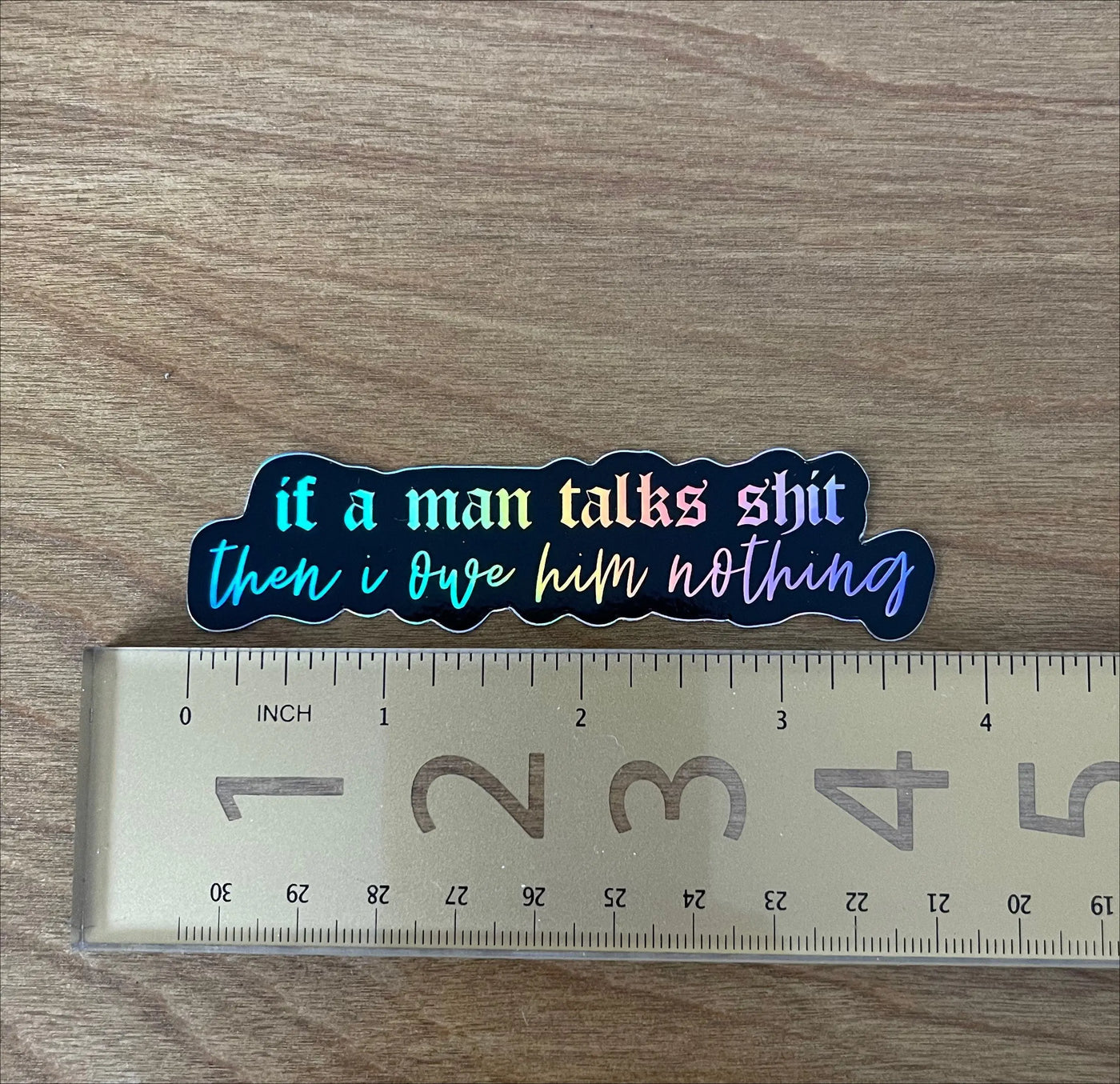 If a man talks shit then I owe him nothing holographic sticker MangoIllustrated
