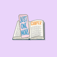 Just One More Chapter sticker flat lay — illustrated reading sticker by indie artist MangoIllustrated