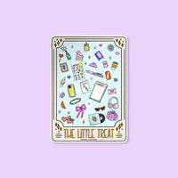 The Little Treat Tarot Card sticker flat lay — mystical treat yourself waterproof vinyl sticker for laptops and planners by indie artist MangoIllustrated