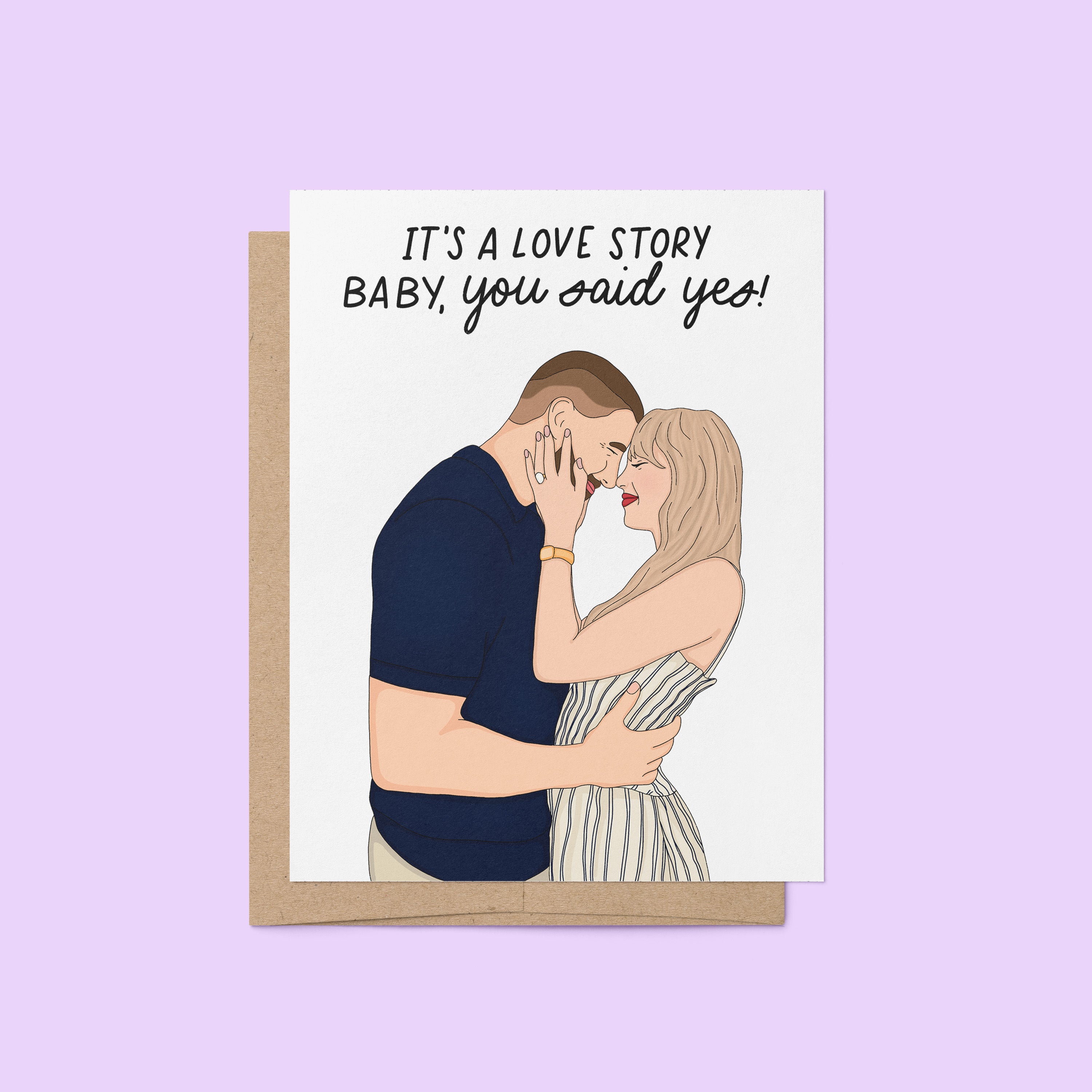 Illustrated engagement card featuring a couple embracing with the caption “It’s a love story baby, you said yes!” above them.