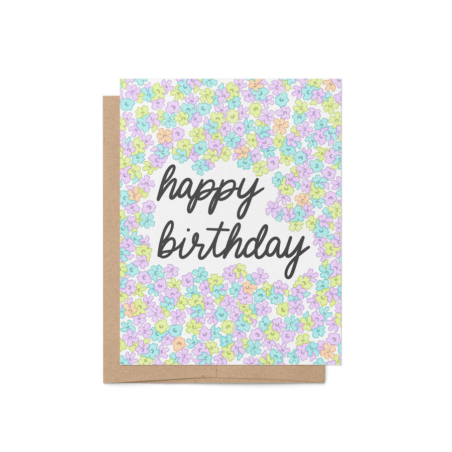 neon floral birthday card—featuring hand-lettered script and bold purple, blue, and green flower doodles.