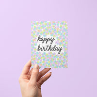neon floral birthday card—featuring hand-lettered script and bold purple, blue, and green flower doodles.
