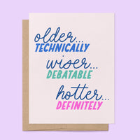 Older Wiser Hotter Birthday Card flat lay — snarky funny birthday card for her by indie artist MangoIllustrated