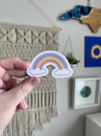 Rainbow clouds sticker MangoIllustrated