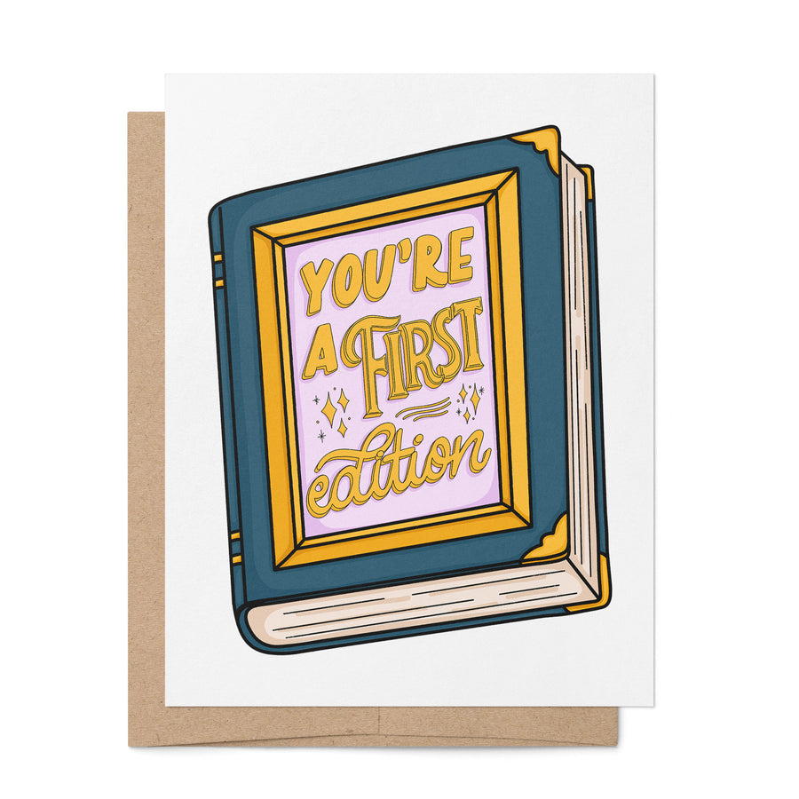 You're a First Edition bookish birthday card by MangoIllustrated — hand lettered gold book illustration