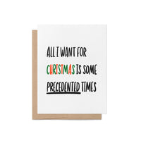 Holiday greeting card with bold black text reading “All I Want For Christmas is Some Precedented Times,” with "Christmas" in festive red and green letters.