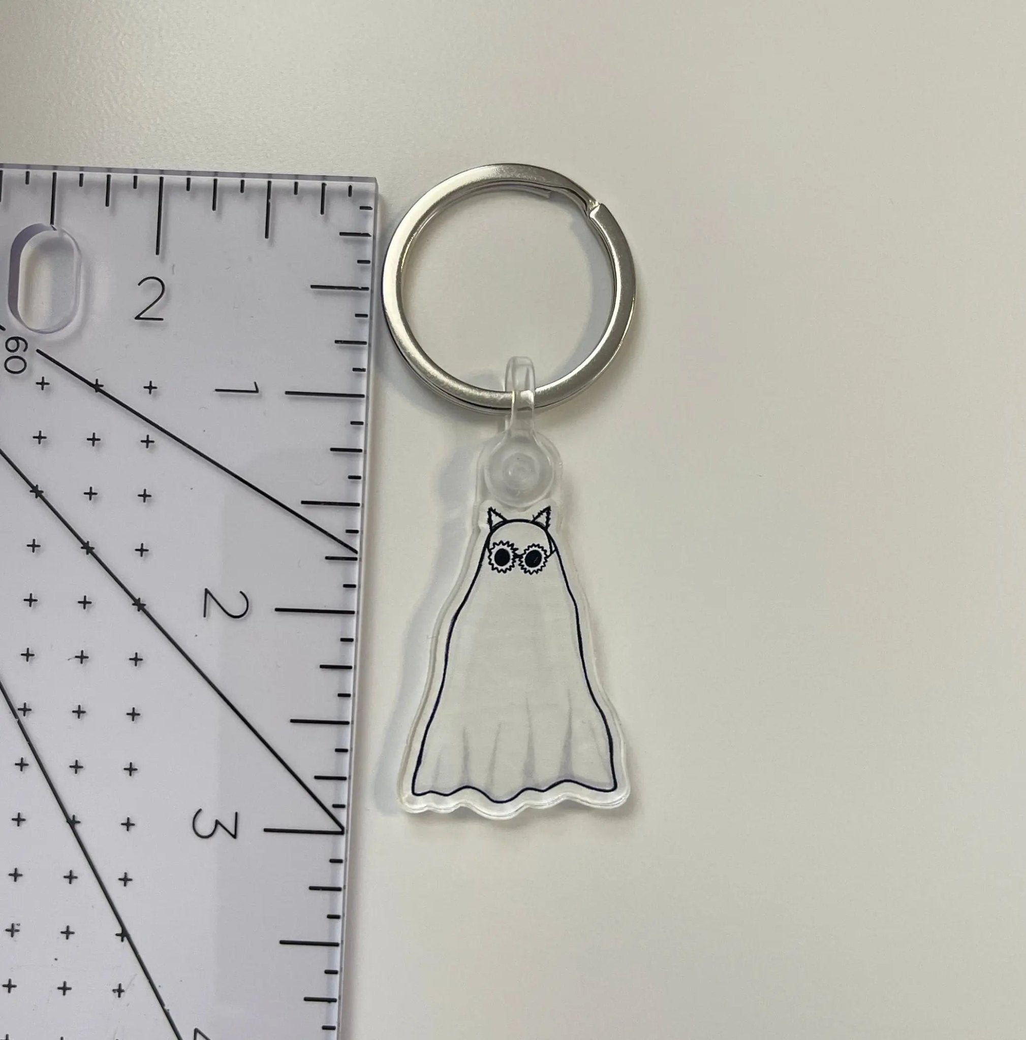 Anti - hero Ghost acrylic keychain - MangoIllustrated - Accessories