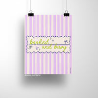 8x10 art print with the phrase "booked and busy" in green script over a pastel pink and lavender striped background with bows and stars