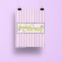 8x10 art print with the phrase "booked and busy" in green script over a pastel pink and lavender striped background with bows and stars