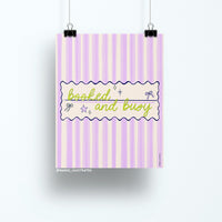 8x10 art print with the phrase "booked and busy" in green script over a pastel pink and lavender striped background with bows and stars