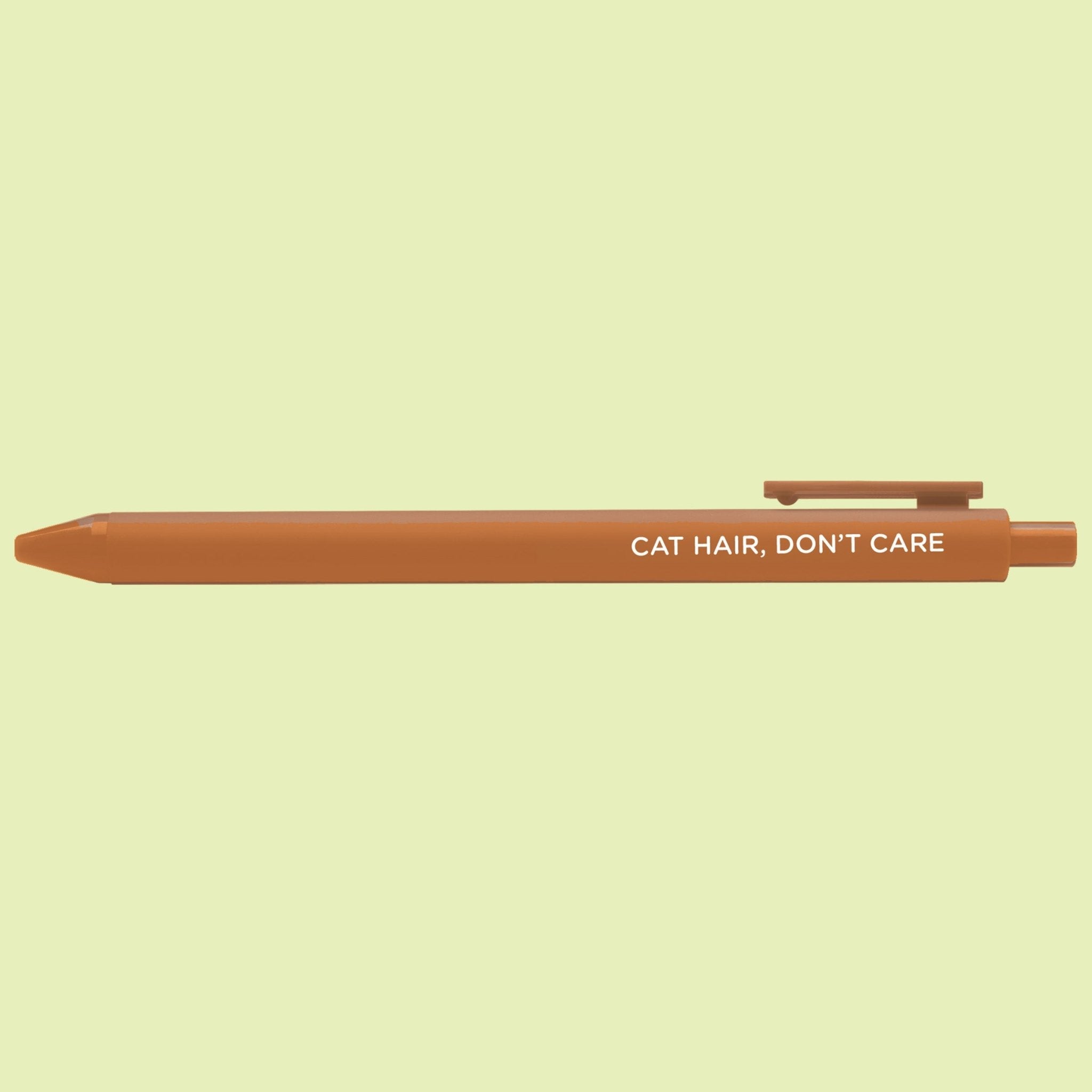 Brown pen with 'Cat Hair, Don't Care' text on a light green background