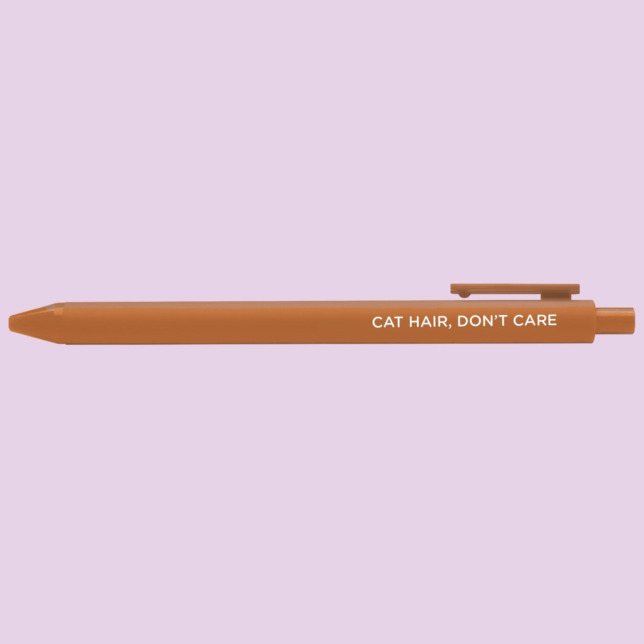 Brown pen with 'Cat Hair, Don't Care' text on a light purple background