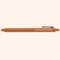 Brown pen with 'Cat Hair, Don't Care' text on a white background