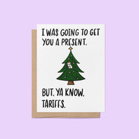 Funny Christmas card with a decorated tree and the text “I was going to get you a present. But, ya know, tariffs.”