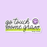 Go Touch Some Grass hand lettered sticker flat lay — waterproof illustrated vinyl sticker by MangoIllustrated