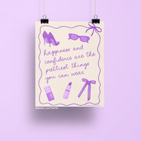 8x10 art print featuring purple illustrations of high heels, sunglasses, lipstick, nail polish, and a bow, with the quote "Happiness and confidence are the prettiest things you can wear."