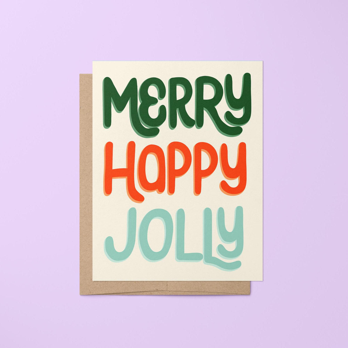 Celebrate the holiday season with this &quot;Merry Happy Jolly&quot; card. This hand lettered card features the greeting &quot;Merry Happy Jolly&quot; in fun hand lettering in shades of red, green, and blue.