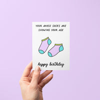 Apparently wearing ankle socks is the sign of a millennial. Who knew our socks gave away our age... Tell your millennial besties &quot;happy birthday&quot; with this &quot;your ankle socks are showing your age&quot; birthday card with an illustration of ankle socks.