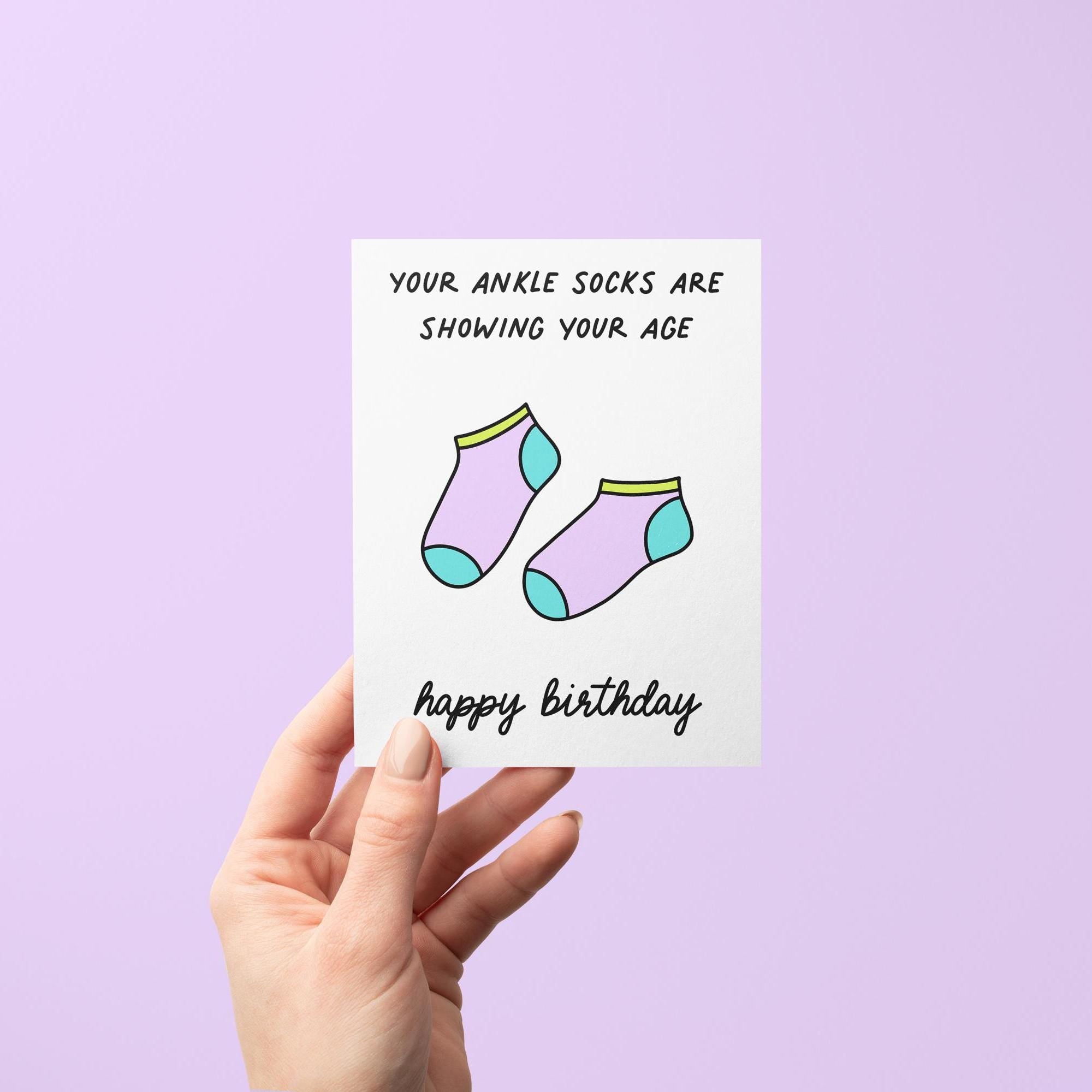 Apparently wearing ankle socks is the sign of a millennial. Who knew our socks gave away our age... Tell your millennial besties &quot;happy birthday&quot; with this &quot;your ankle socks are showing your age&quot; birthday card with an illustration of ankle socks.