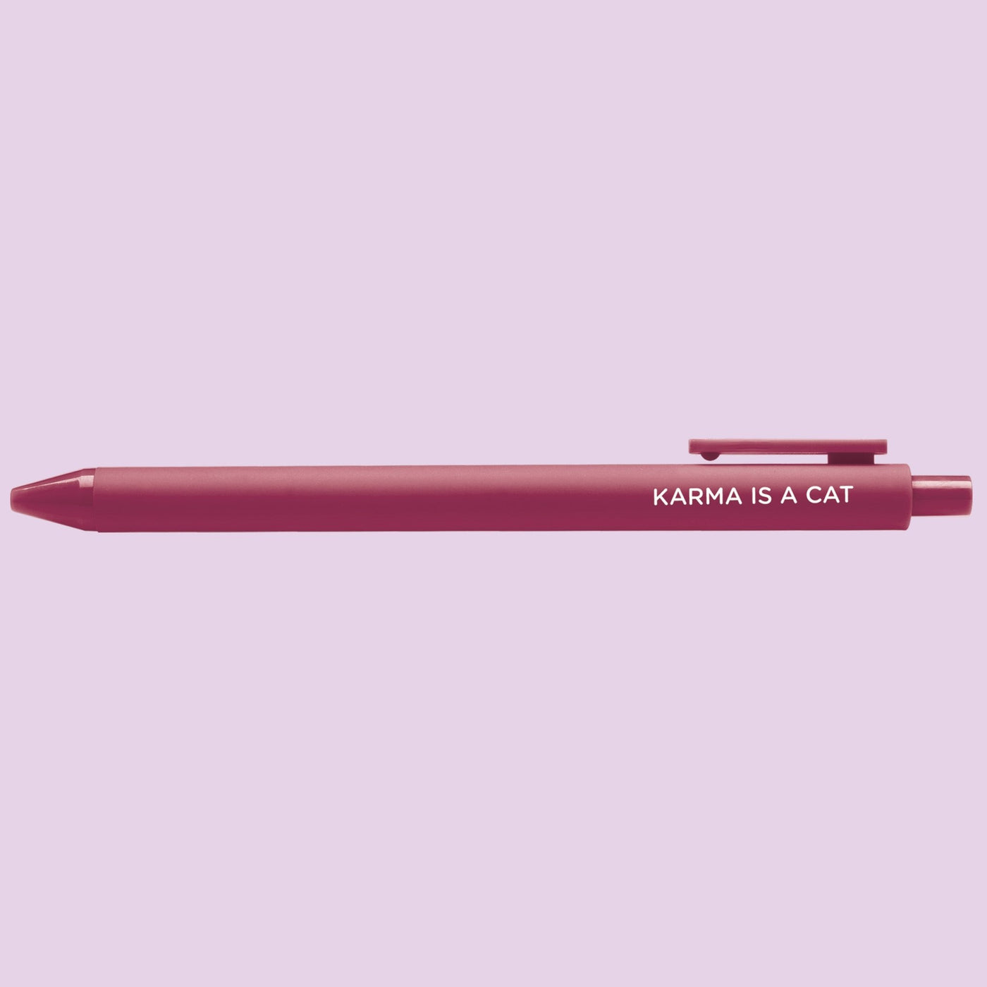 Pink pen with 'Karma is a Cat' text on a light purple background
