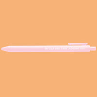 Pink pen with text on a peach background