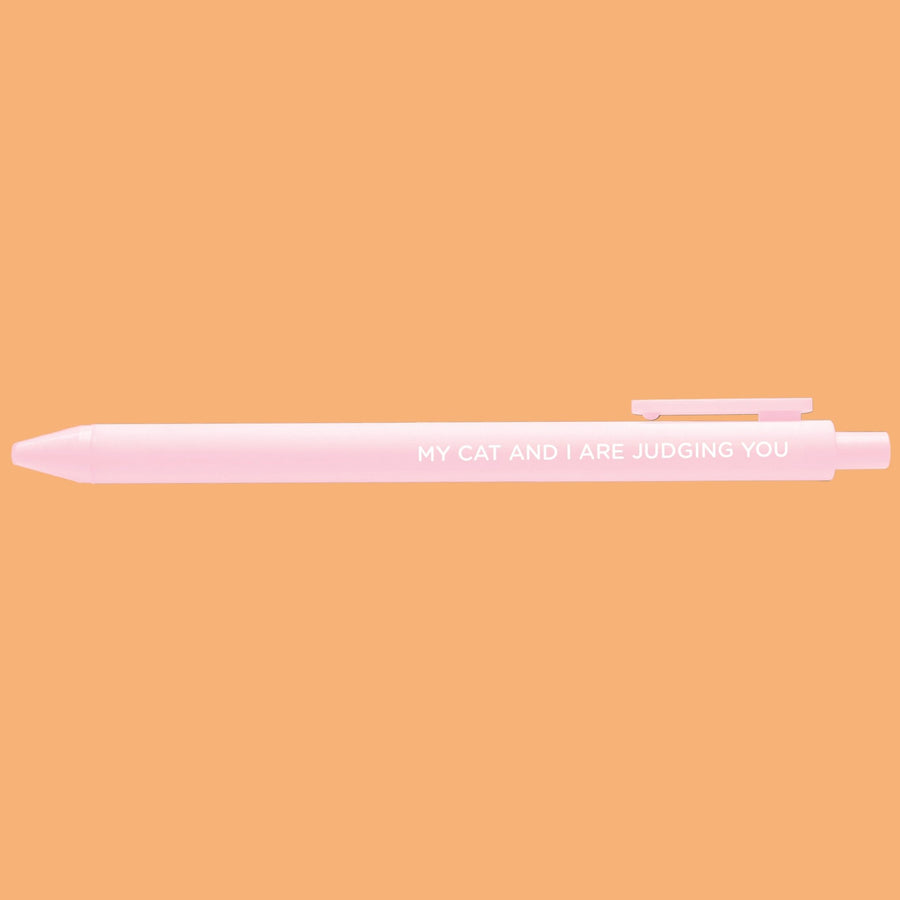 Pink pen with text on a peach background