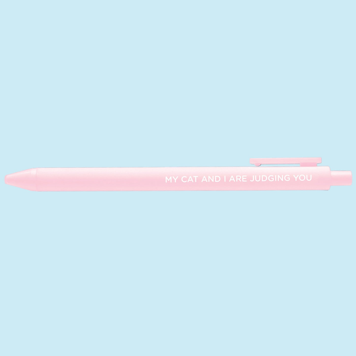 Pink pen with text on a light blue background