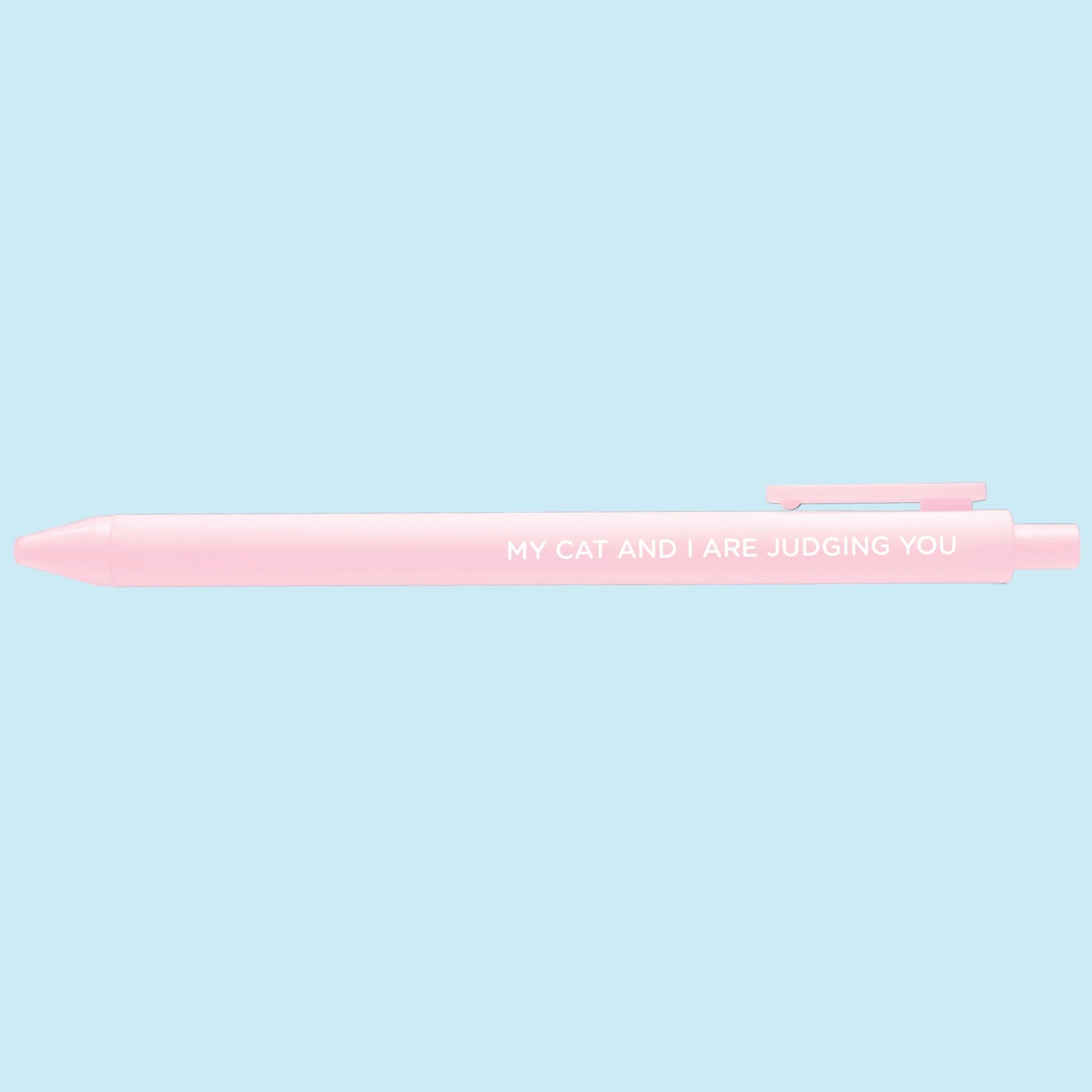 Pink pen with text on a light blue background
