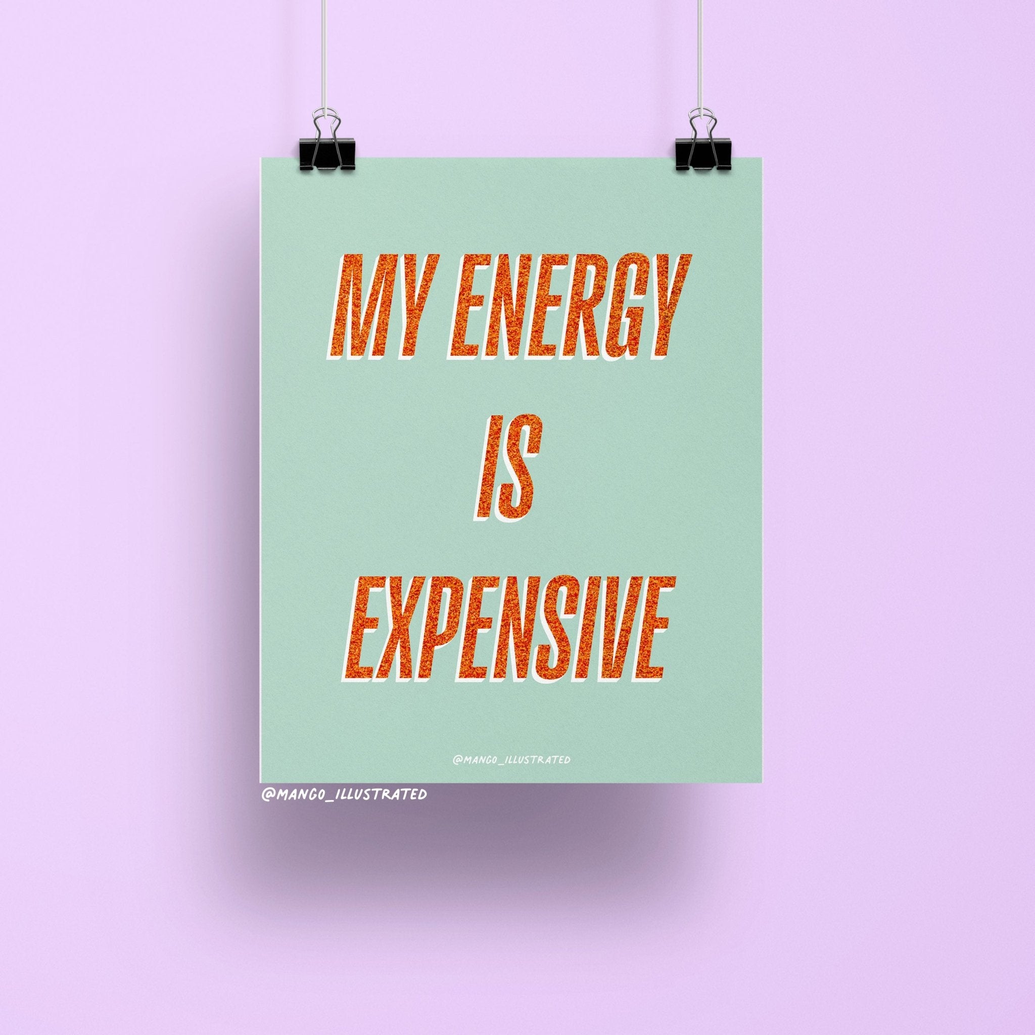 8x10 art print with bold orange glitter-style text reading “My Energy is Expensive” on a mint green background, printed on matte paper and packaged with cardboard backing in a cellophane sleeve.
