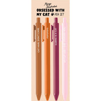 Set of four colorful pens with cat-themed quotes: “Cat Hair, Don’t Care,” “PSPSPSPS,” “Karma is a Cat,” and “My Cat and I Are Judging You,” packaged on a decorative card reading “Obsessed With My Cat Pen Set.”