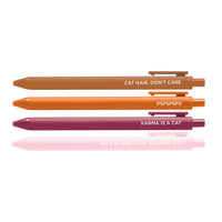 Set of four colorful pens with cat-themed quotes: “Cat Hair, Don’t Care,” “PSPSPSPS,” “Karma is a Cat,” and “My Cat and I Are Judging You."