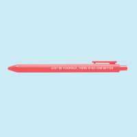 Neon coral pen with the motivational quote “Just be yourself, there is no one better” printed in white text.