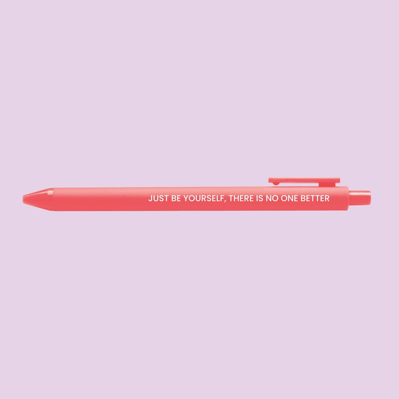 Neon coral pen with the motivational quote “Just be yourself, there is no one better” printed in white text.