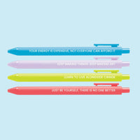 Set of four colorful pens with motivational affirmations, including “Your energy is expensive,” “Keep making art,” “Live alongside cringe,” and “Just be yourself.”