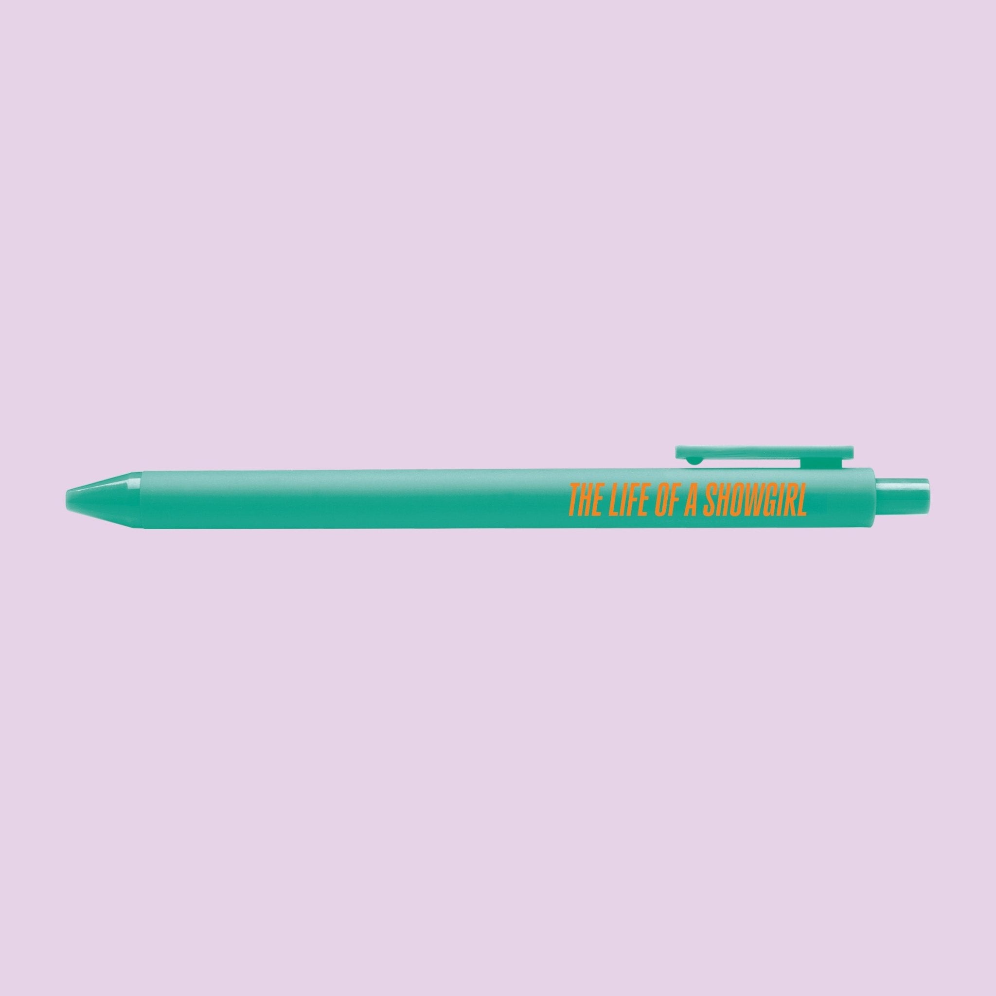 Teal pen with orange text reading "The Life of a Showgirl," pop star inspired stationery for Swifties and music lovers.