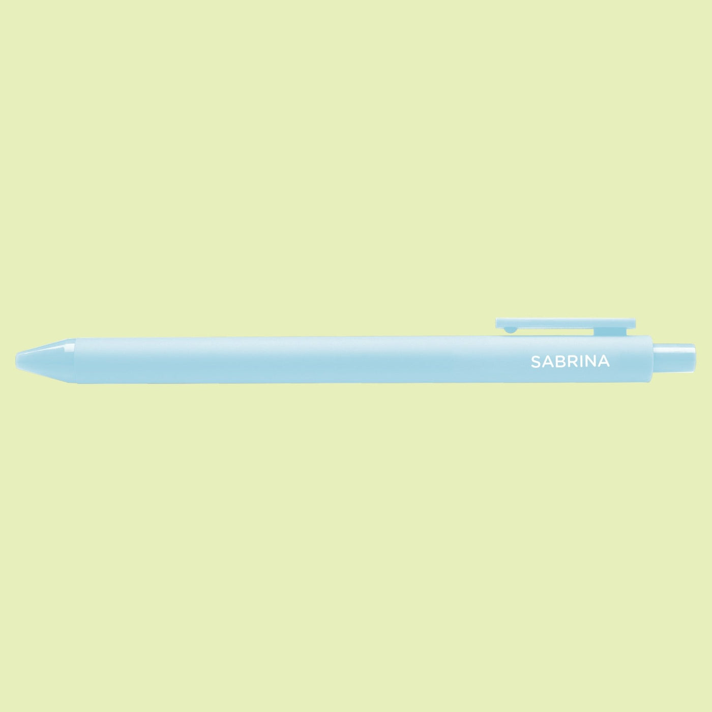 Light blue pen with 'Sabrina' text on a light green background