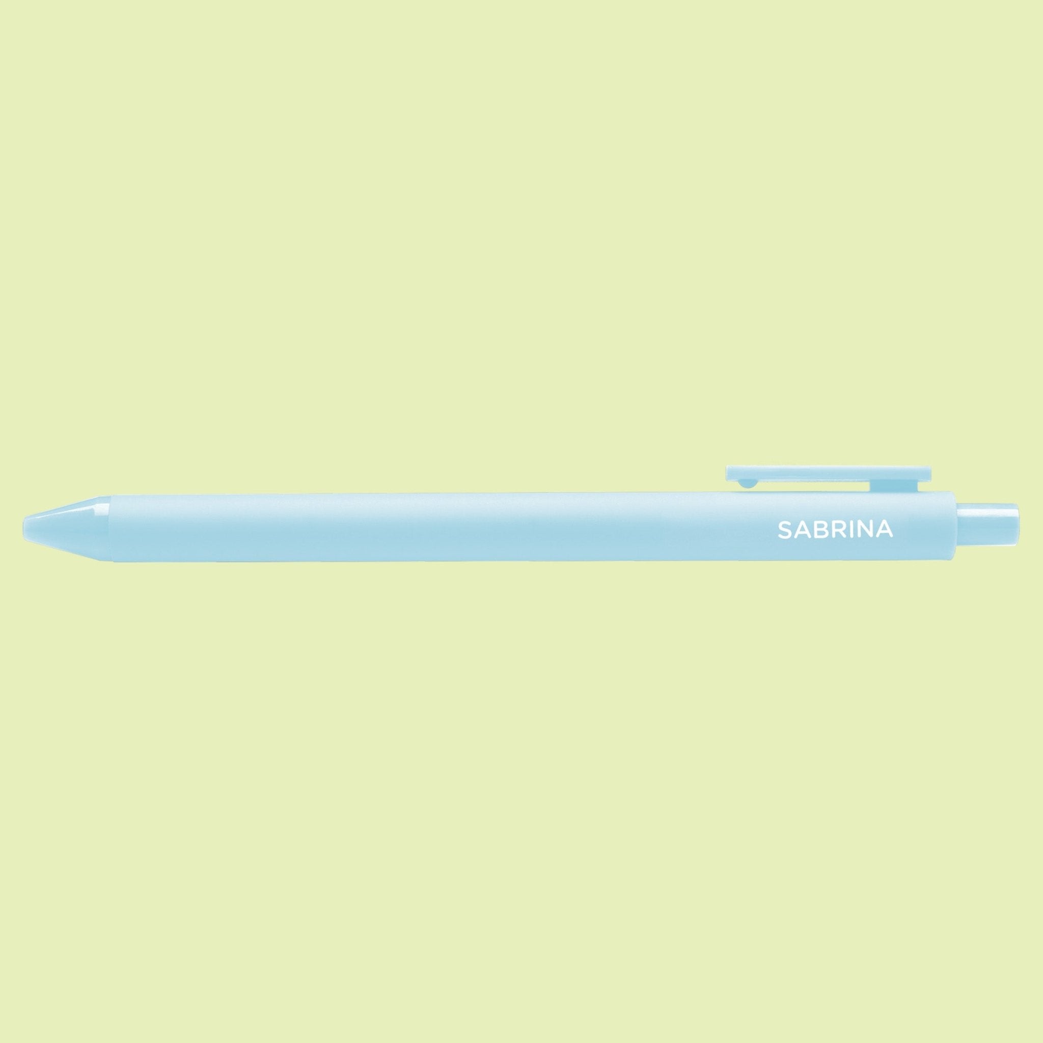 Light blue pen with 'Sabrina' text on a light green background