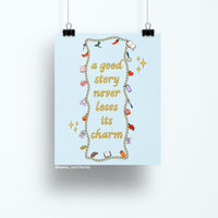 8x10 art print with the quote "a good story never loses its charm" surrounded by colorful illustrated charms on a light blue background