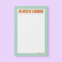 Notepad with mint green border and bold orange text “The Notes of a Showgirl” with star accents – glam stationery pad for lists and journaling.