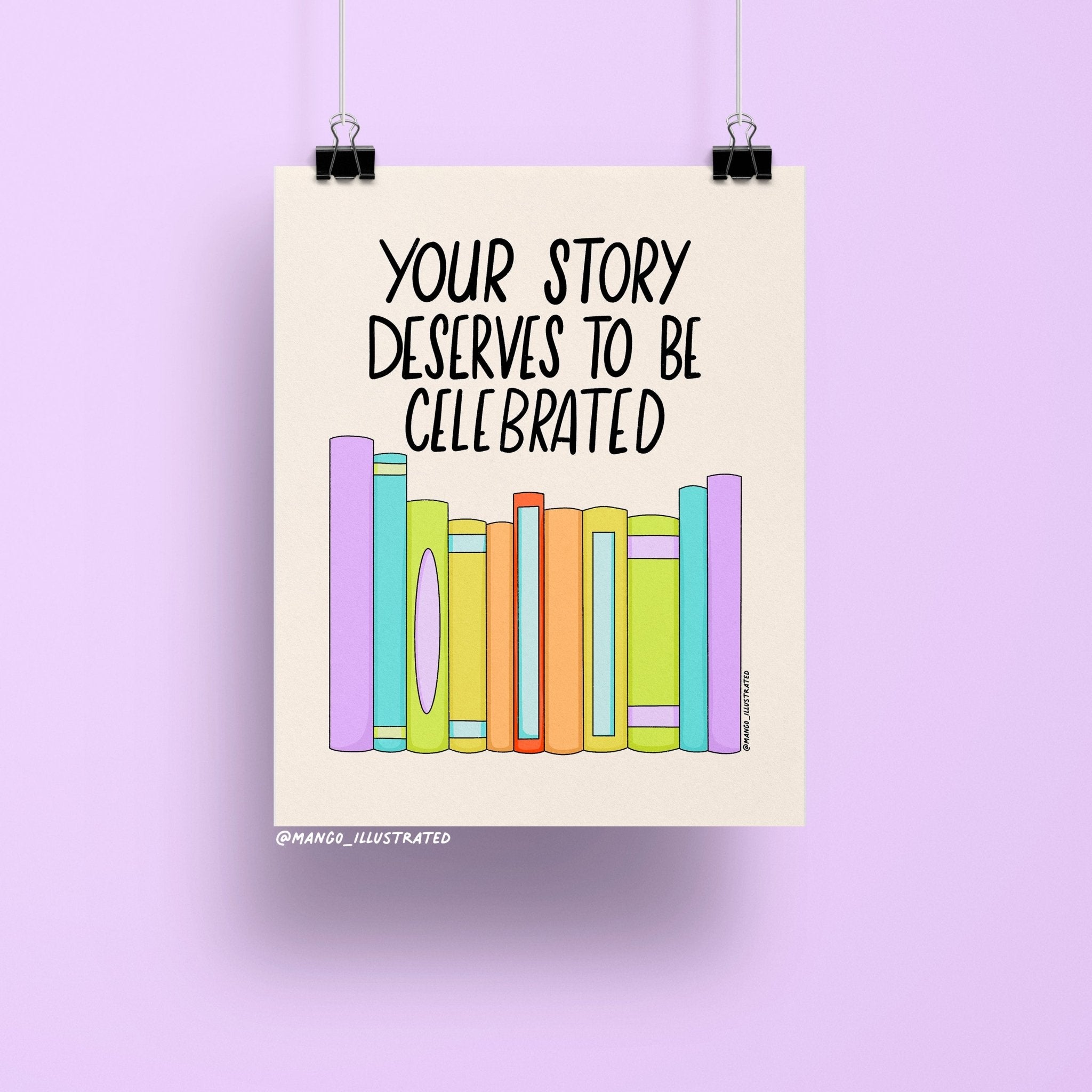 8x10 art print with the quote “Your Story Deserves to Be Celebrated” above a row of colorful pastel books on a neutral background