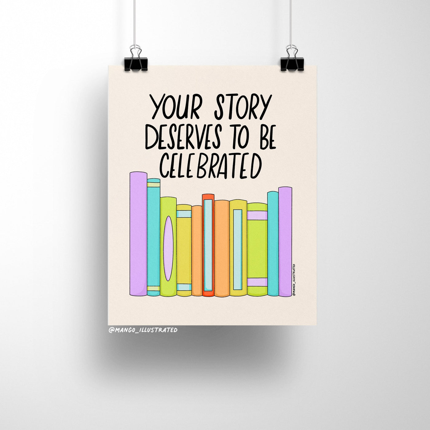 8x10 art print with the quote “Your Story Deserves to Be Celebrated” above a row of colorful pastel books on a neutral background