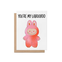 Greeting card with the phrase “You’re My Labooboo” above a cute pink monster illustration, blank inside with kraft envelope.